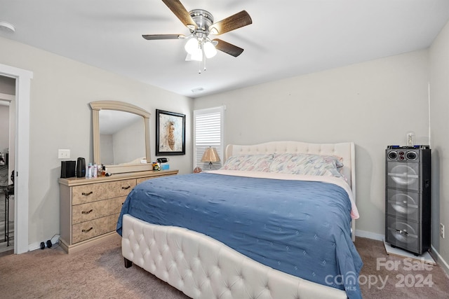 bedroom with ceiling fan and carpet floors