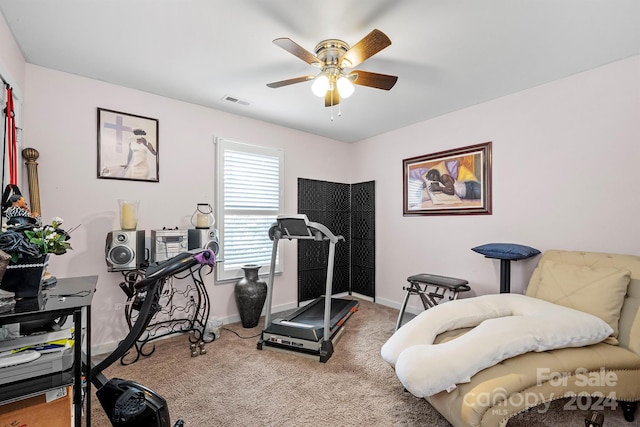 workout room with ceiling fan and carpet floors