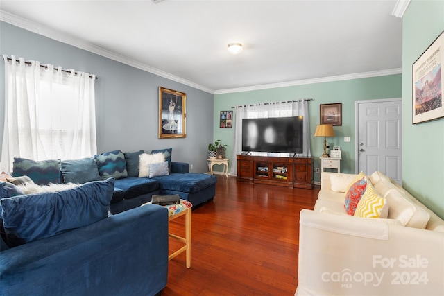 living room with crown molding and dark hardwood / wood-style flooring