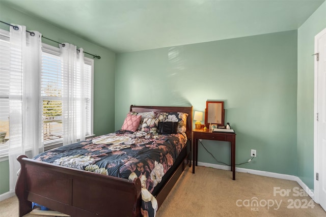 bedroom with light carpet