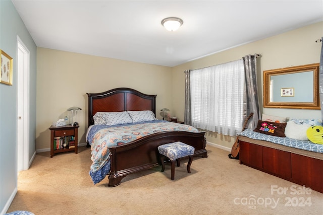 bedroom with light carpet