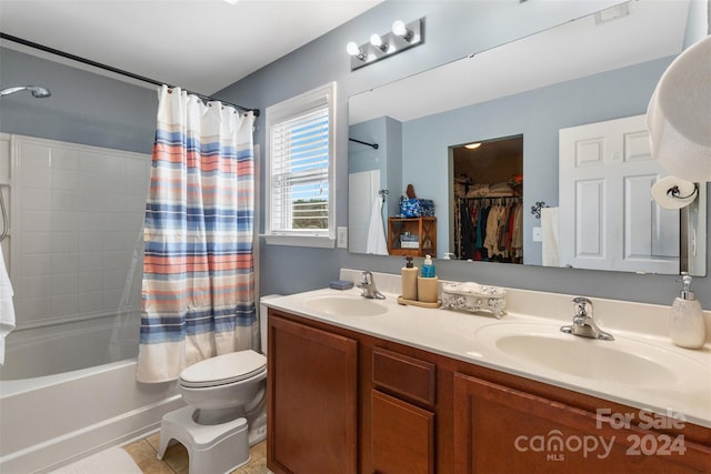 full bathroom with vanity, tile patterned floors, toilet, and shower / tub combo with curtain