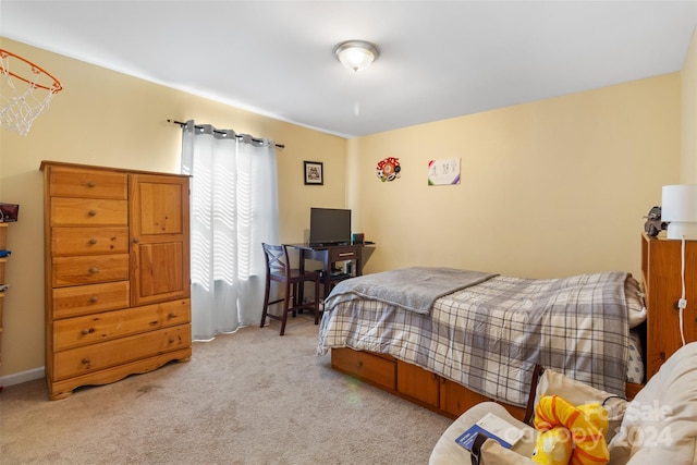 bedroom with light colored carpet