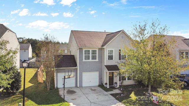 view of front property with a garage and a front yard