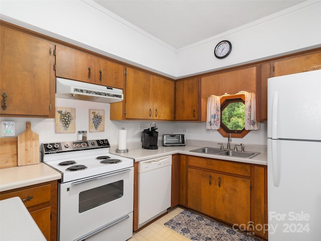 kitchen with sink and white appliances