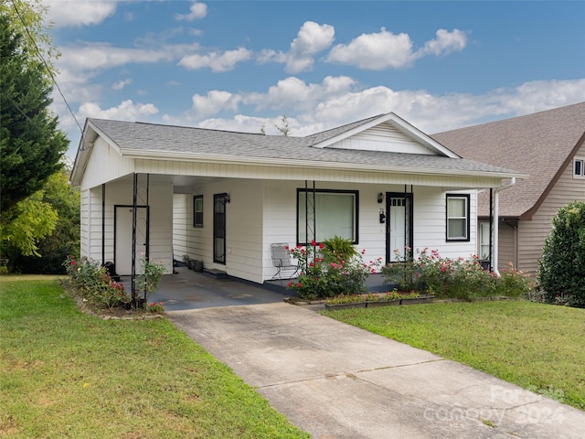 ranch-style house with a front yard and a porch