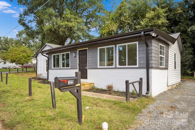 ranch-style house with a front yard