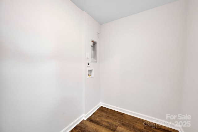 clothes washing area featuring dark hardwood / wood-style flooring, hookup for a washing machine, and hookup for an electric dryer