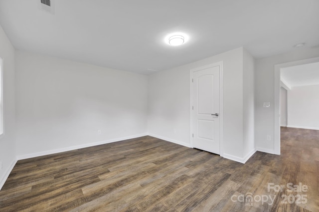 additional living space with dark hardwood / wood-style floors