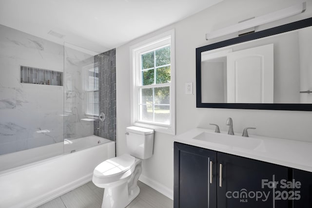 full bathroom with tile patterned flooring, vanity, toilet, and tiled shower / bath