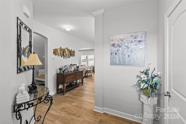 hallway with light hardwood / wood-style floors