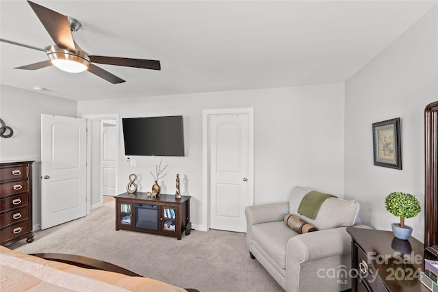 bedroom featuring ceiling fan and light carpet