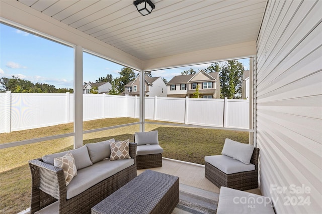 sunroom featuring wooden ceiling