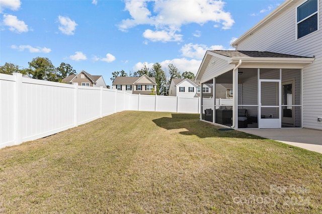 view of yard featuring a sunroom