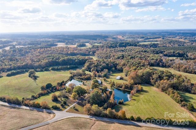 birds eye view of property featuring a rural view and a water view