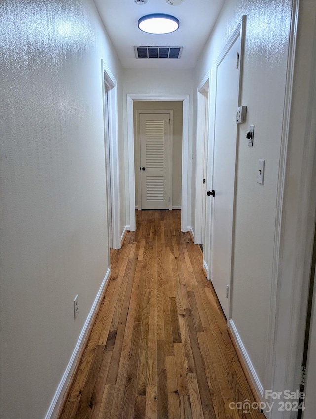 hallway featuring light hardwood / wood-style flooring