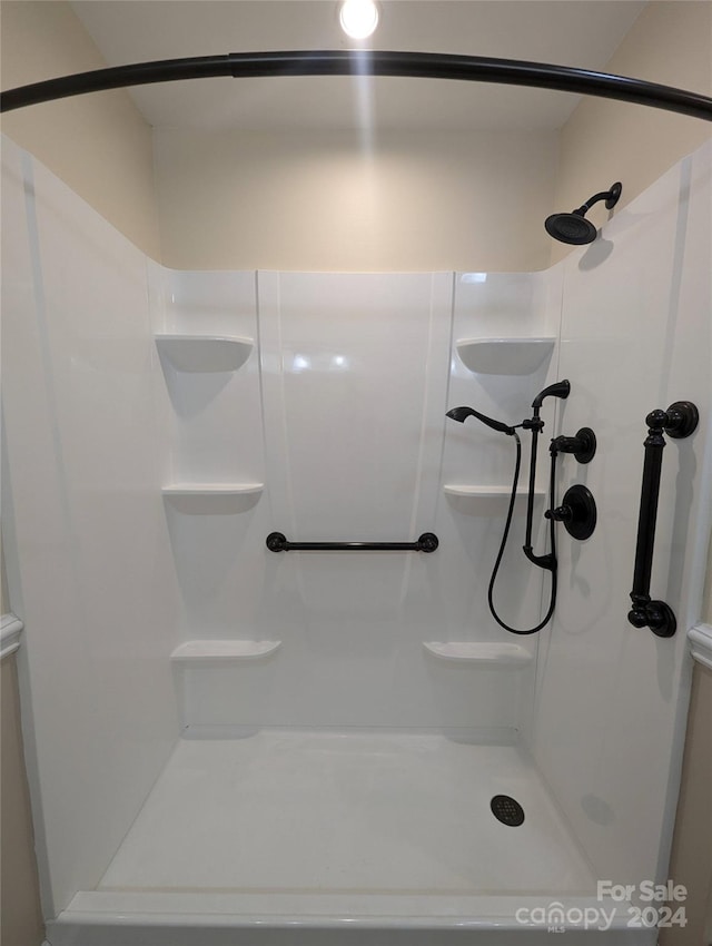 bathroom featuring walk in shower