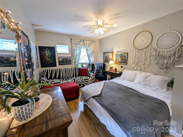 bedroom with hardwood / wood-style flooring and ceiling fan