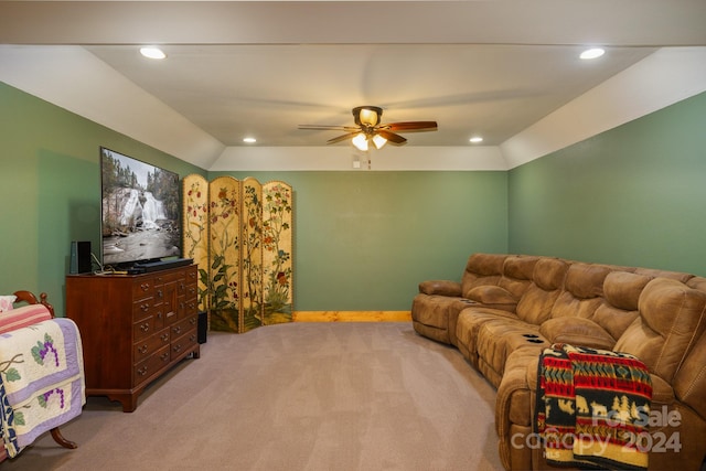 living room with light carpet, lofted ceiling, and ceiling fan