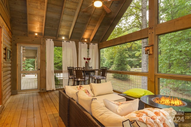 sunroom featuring ceiling fan, lofted ceiling, and wood ceiling