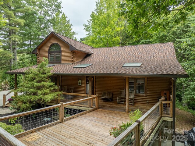 17200 Rosman Hwy, Lake Toxaway, NC 28747 - view of front facade featuring log siding, a porch, and roof with shingles