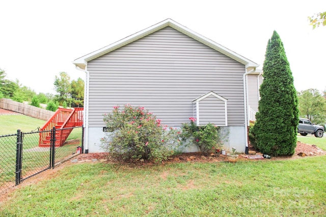 view of home's exterior with a lawn