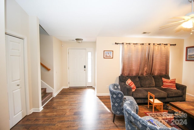 interior space with ceiling fan and dark wood-type flooring