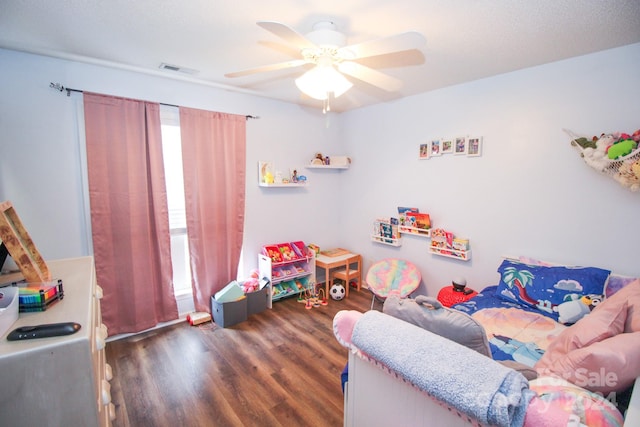 interior space featuring ceiling fan and dark hardwood / wood-style flooring