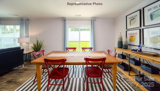 dining room with dark wood-type flooring