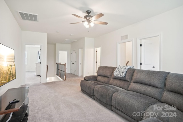 living room featuring ceiling fan and light colored carpet