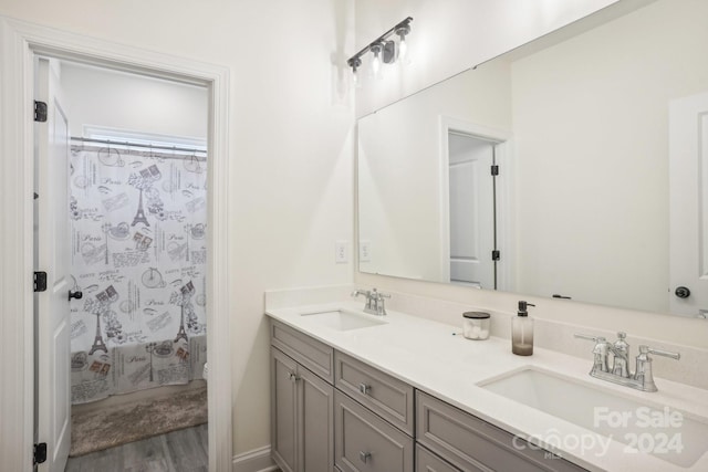 bathroom featuring vanity and hardwood / wood-style floors