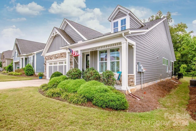 view of front of house with a garage and a front lawn