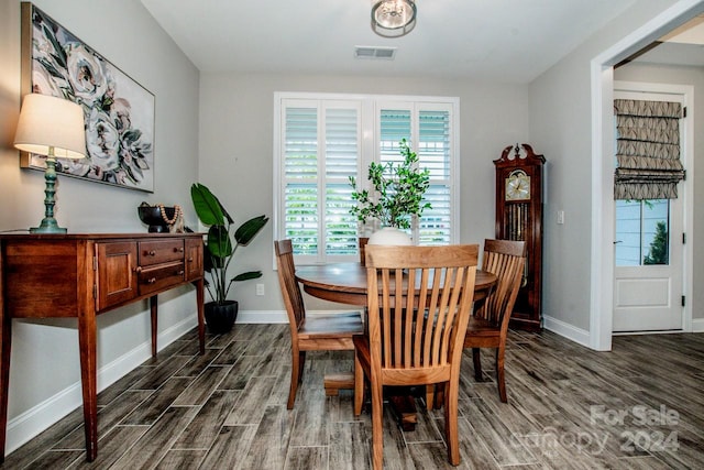 dining space featuring dark hardwood / wood-style flooring