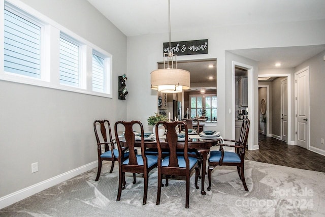 dining space with wood-type flooring