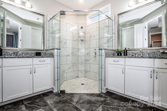 bathroom with vanity and an enclosed shower