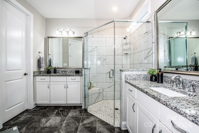 bathroom featuring vanity and an enclosed shower