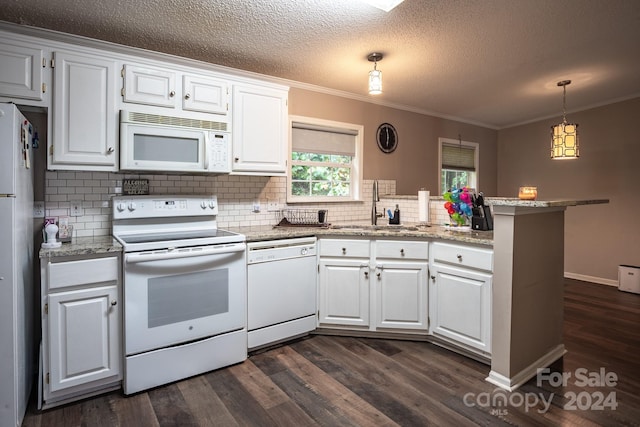 kitchen featuring white cabinetry, sink, hanging light fixtures, kitchen peninsula, and white appliances