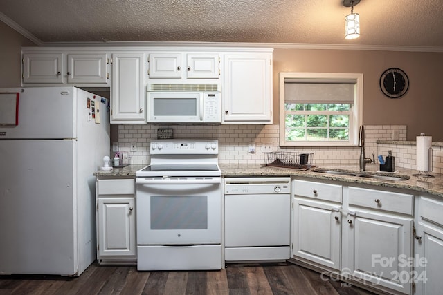 kitchen with white appliances, crown molding, sink, dark hardwood / wood-style floors, and white cabinetry