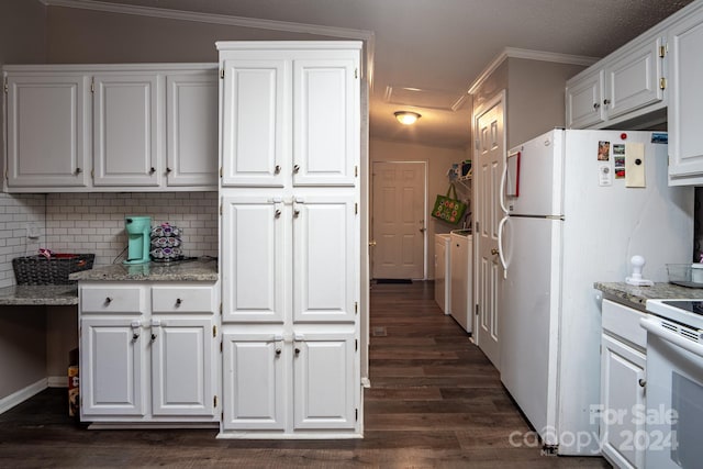 kitchen featuring dark hardwood / wood-style floors, white cabinetry, crown molding, and vaulted ceiling