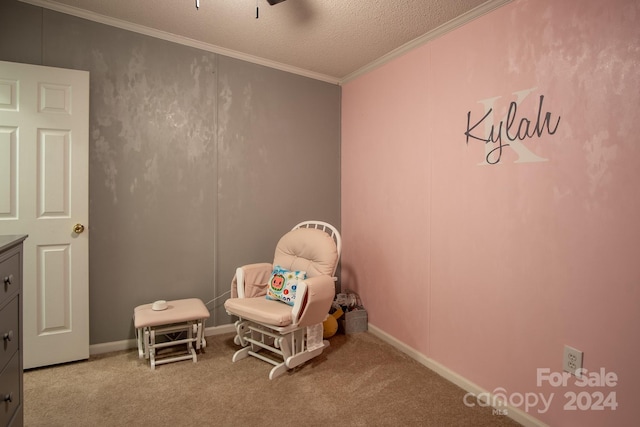 sitting room featuring baseboards, carpet, crown molding, and a textured ceiling