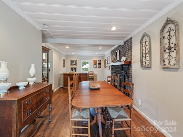 dining space with wood-type flooring, a fireplace, and crown molding