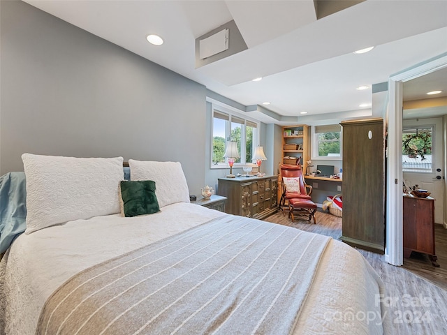 bedroom with hardwood / wood-style floors