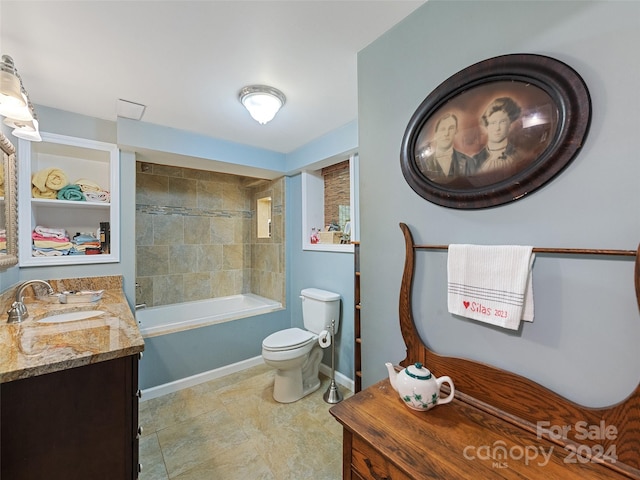 full bathroom with tiled shower / bath combo, vanity, and toilet