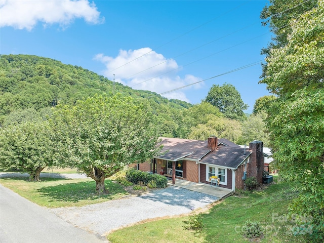 ranch-style house with central air condition unit