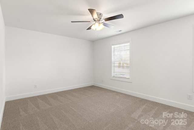 carpeted empty room with ceiling fan