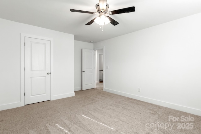 unfurnished bedroom with ceiling fan and light carpet