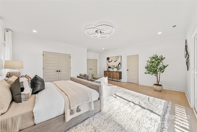 bedroom with light hardwood / wood-style flooring