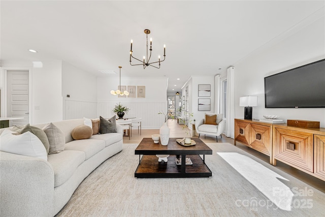 living room with a chandelier and hardwood / wood-style floors