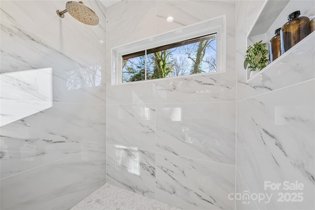 interior space with tiled shower