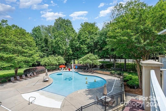 view of swimming pool featuring a patio